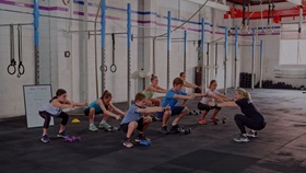 RSL Education children squatting in exercise class